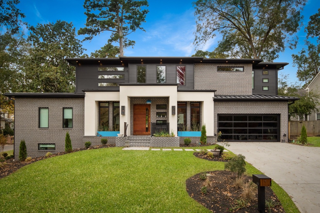 Exterior of The Dogwood Residence, a completed modern dark brick home by IEMG Development.