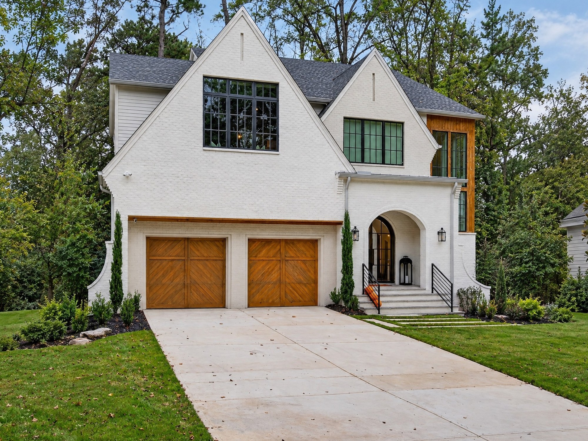 Exterior of The Winding Residence, a completed white brick home by IEMG Development.