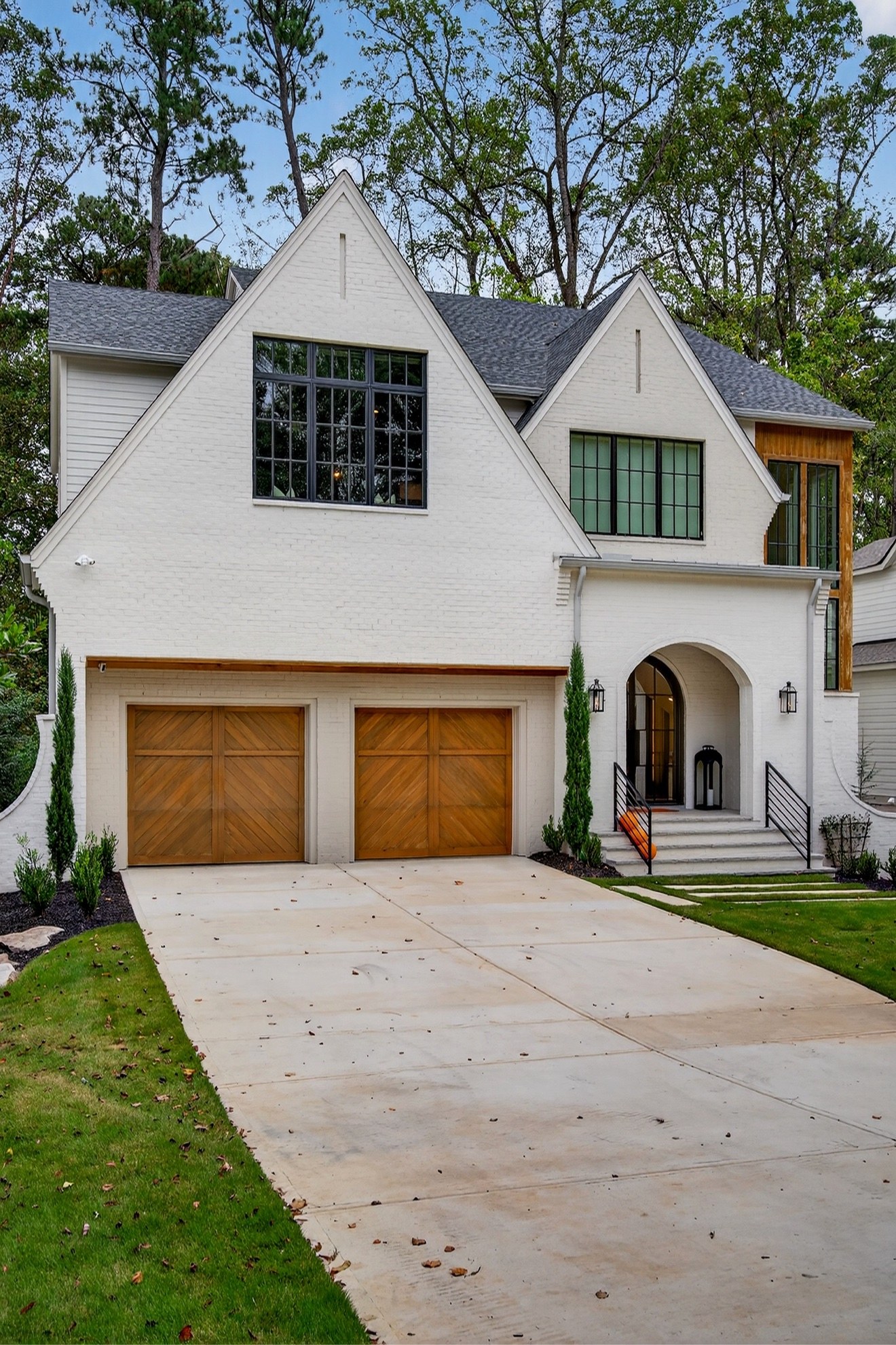Exterior of The Winding Residence, a completed white brick home by IEMG Development.