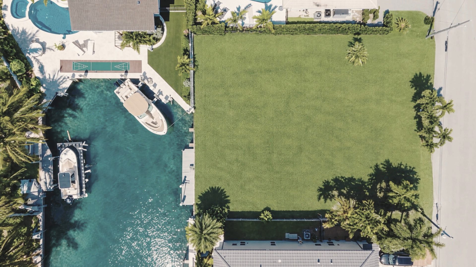 Aerial view of a canal-front lot in Miami, the site of an IEMG Development home.